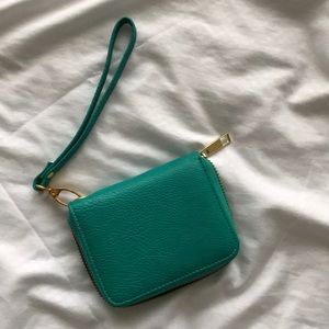 Turquoise leather wallet/wristlet.